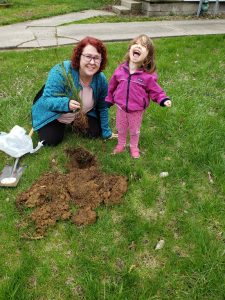 My daughter and I planting a tree.