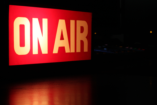 A glowing sign reading "On Air"