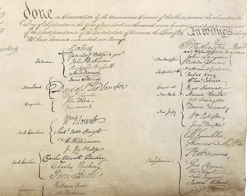 A close-up of the founders' signatures on the Constitution
