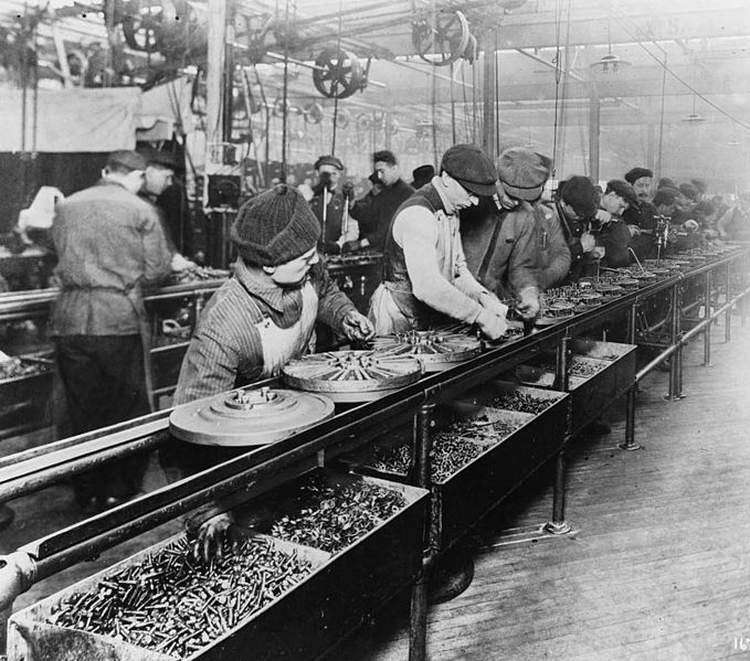 A black and white photo of a factory assembly line