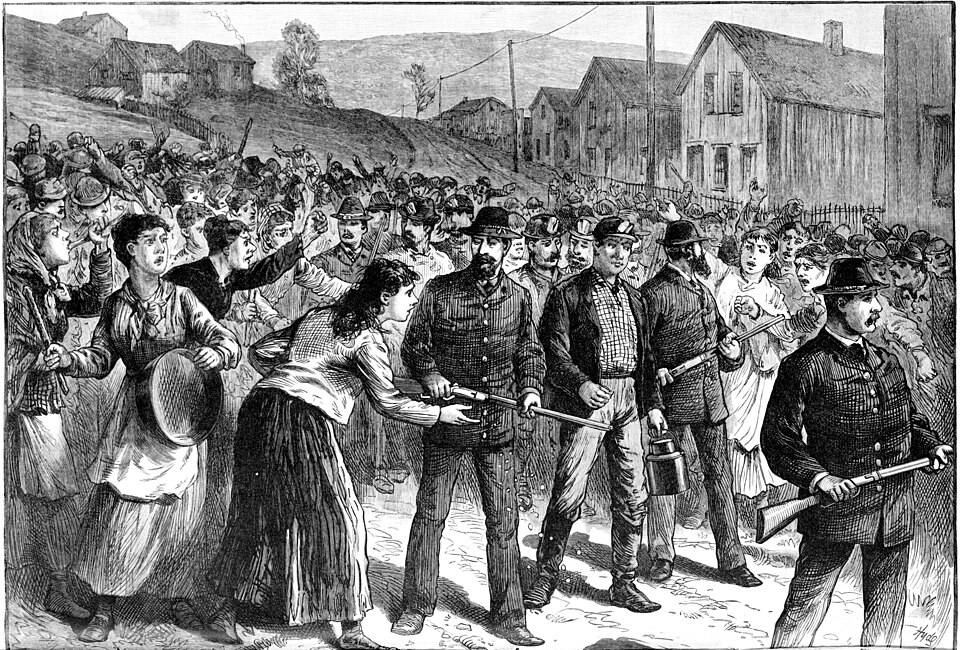 Strikebreaking miners being escorted to work by Pinkerton agents, 1884