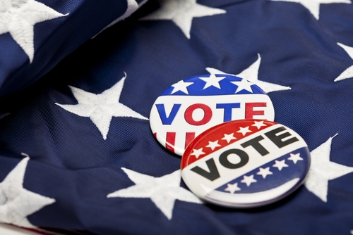 Two buttons reading "Vote" on a folded flag