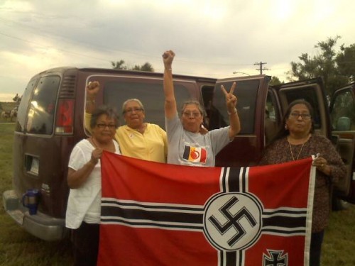 Lakota and Dakota grandmothers captured the Nazi flag hanging in Leith, ND and burned it. Warriors!