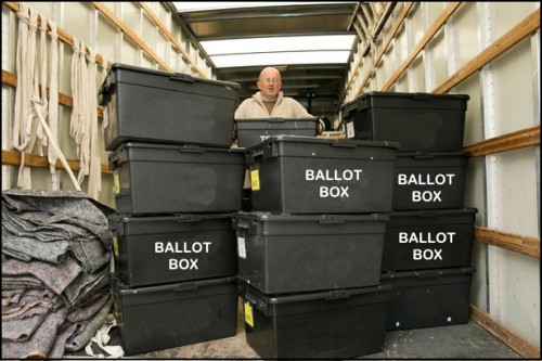 Prince, shown here, poses with his find, as election officials investigate.