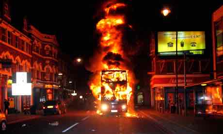 A Bus Burning in Tottenham, twitter via the [Guardian]